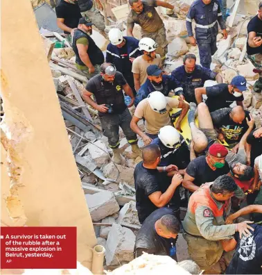  ?? AP ?? A survivor is taken out of the rubble after a massive explosion in Beirut, yesterday.