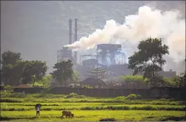  ?? Altaf Qadri Associated Press ?? COAL POWERS a steam plant in India’s Jharkhand state. The country’s energy demands are soaring, and renewable sources aren’t enough to meet them.