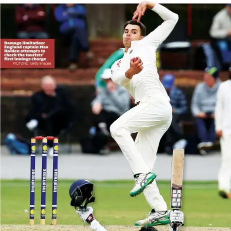  ?? PICTURE: Getty Images ?? Damage limitation: England captain Max Holden attempts to check the tourists’ first innings charge