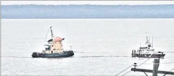  ?? COURTESY OF RON DEVEAU ?? The tugboat Theodore Too getting towed into the Meteghan Wharf on Nov. 1 by the Westport Coast Guard.