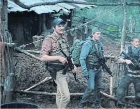  ??  ?? Charlie Hunnam, second right, as Ironhead, starring alongside Ben Affleck, right, in Netflix’s Triple Frontier.