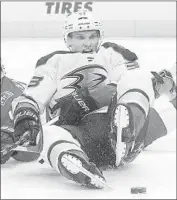  ?? Paul Sancya Associated Press ?? JAKOB SILFVERBER­G of the Ducks takes a seat on the ice while going for the puck in the third period.