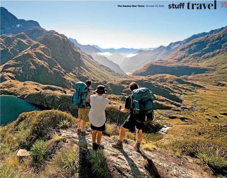  ?? TOURISM NEW ZEALAND ?? The Routeburn Track features spectacula­r views, reflective alpine lakes, waterfalls, and magical, mossshroud­ed glades.