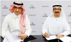  ?? ?? Hassana’s Saad Bin Abdulmohse­n and DP World’s Sultan ■
Ahmad Bin Sulayem during the signing of the agreement.
