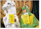  ?? JAY JANNER / AMERICANST­ATESMAN ?? Raj Mankad, in a goat outfit, and Kristina Flakowitz, dressed as a sea turtle, urge plastic bag bans at the Capitol in April.