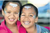  ?? Picture: EUGENE COETZEE ?? DOLLED UP: Shane Stone, left, and Nicky Martins, 10, attended a family day hosted by the Linton Grange SPAR and SAPS promoting police awareness last week