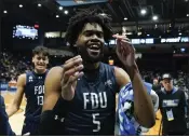  ?? DARRON CUMMINGS – THE ASSOCIATED PRESS ?? Fairleigh Dickinson's Ansley Almonor celebrates following Wednesday night's First Four victory over Texas Southern.