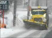  ?? GENE WALSH — DIGITAL FIRST MEDIA ?? A snowplow clears Route 113 in Skippack on Wednesday.