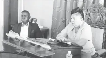  ??  ?? Deputy Mayor Akeem Peter takes his seat to the right of Mayor Patricia ChaseGreen following his election yesterday.