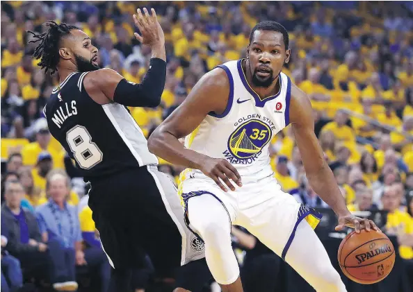  ?? AP PHOTO ?? Golden State’s Kevin Durant drives around San Antonio’s Patty Mills in Game 1 of their NBA playoff Saturday. The Warriors won, 113-92.