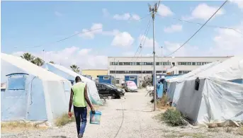  ??  ?? A migrant tent camp in the village of San Ferdinando, near Gioia Tauro, in the southern Italian region of Calabria. — AFP