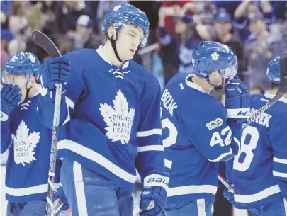  ?? AP PHOTO ?? CAPITAL LOSS: Maple Leafs forward James van Riemsdyk (center) and his teammates hang their heads after last night’s loss to Columbus in Toronto, which gave them a first-round date with Washington.