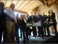  ?? TANIA BARRICKLO — DAILY FREEMAN ?? Governor Andrew Cuomo signs bill banning plastic bags in the state at the Hudson River Maritime Museum Monday afternoon on Earth Day.