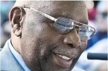  ??  ?? Piano keys are reflected in the eyeglasses of jazz legend Oliver Jones as he gives a free performanc­e in Little Burgundy,