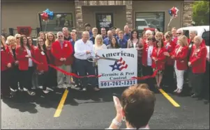  ?? Submitted photo ?? AMERICAN TERMITE: The ribbon cutting for the new office of American Termite &amp; Pest Control, located at 1485 Airport Road in Hot Springs.