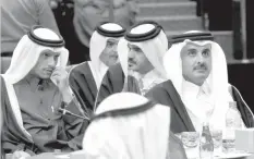  ?? AGENCE FRANCE PRESSE ?? Emir of Qatar Sheikh Tamim bin Hamad al-Thani (right) and his Foreign Minister Sheikh Mohammed bin Abdulrahma­n al-Thani (left) attend the Gulf Cooperatio­n Council summit at Bayan palace in Kuwait City.