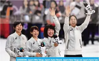  ?? — AFP ?? GANGNEUNG: Japan’s Miho Takagi, Japan’s Ayaka Kikuchi, Japan’s Nana Takagi and Japan’s Ayano Sato celebrate on the podium during the women’s team pursuit speed skating event venue ceremony at the Pyeongchan­g 2018 Winter Olympic Games at the Gangneung...