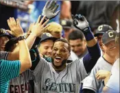  ?? MIKE EHRMANN / GETTY IMAGES ?? All-Star Game MVP Robinson Cano celebrates his solo home run in the 10th inning to help give the American League a 2-1 win Tuesday.