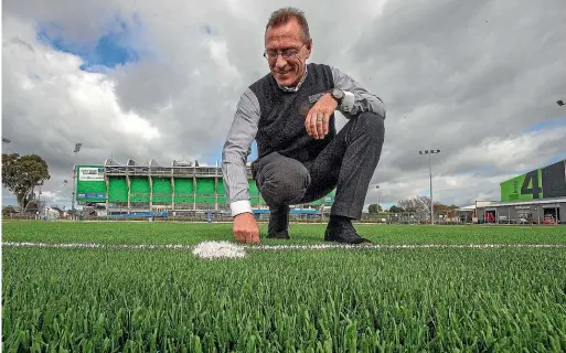  ?? WARWICK SMITH/STUFF ?? Arena venues manager John Lynch checks out the new surface before its first use today.
