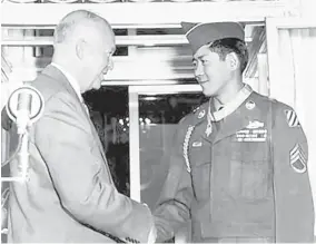  ?? DEPARTMENT OF DEFENSE ?? New Mexico resident Hiroshi “Hershey” Miyamura, right, is presented the Medal of Honor by President Dwight D. Eisenhower in October 1953. Miyamura may get a chance to meet with another president when he serves as a grand marshal of the 2019 New York City Veterans Day Parade on Monday. President Trump is expected to speak during the opening ceremony.