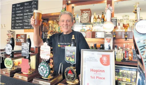  ??  ?? TRIPLE SUCCESS: Martin Ford, landlord of The Hopinn, in Newcastle, which has won the CAMRA Pub of the Year award for the third time.