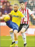  ??  ?? TUSSLE: Leeds United’s Kemar Roofe holds off Sheffield United’s John Egan