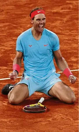  ?? Reuters/AP ?? Remarkable feat: Rafael Nadal celebratin­g after beating Novak Djokovic at the French Open final. Left: Djokovic reacts after missing a shot. —