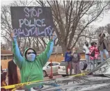  ?? CHRISTIAN MONTERROSA/AP ?? Protesters clash with police Sunday near the site where a police officer fatally shot a man in Brooklyn Center, Minn., earlier that day.