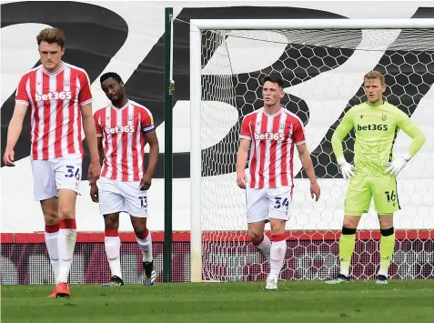  ??  ?? HOME WOE: Stoke City’s players show their dejection after conceding a goal in the defeat by QPR at the weekend.