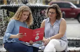  ?? JOHN RAOUX — THE ASSOCIATED PRESS ?? Serra Sowers, left, and her mother, Ebru Ural, look over college brochures in Sanford, Fla., on April 10, 2020.