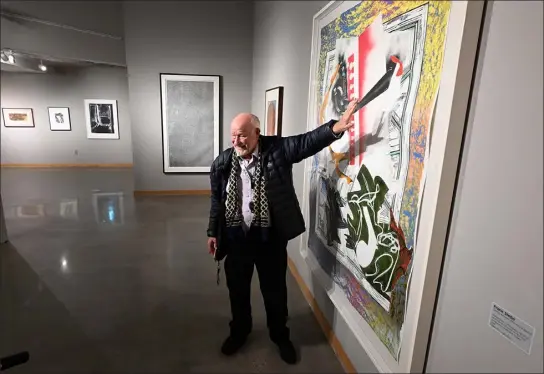  ?? JENNY SPARKS — LOVELAND REPORTER-HERALD ?? Dr. Robert Baller talks about his piece by artist Frank Stella titled “Going Abroad” on display Thursday, as part of the NEW YORK/NEW YORK The Avant-garde from Mid-century exhibit at the Loveland Museum. Baller has pieces from his collection in the exhibit.