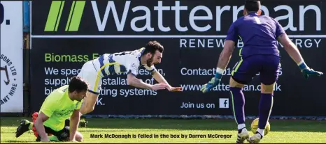  ??  ?? Mark McDonagh is felled in the box by Darren McGregor