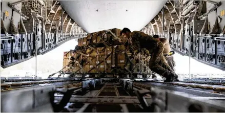  ?? ALEX BRANDON/AP 2022 ?? A pallet of fuses for 155 mm shells, ultimately bound for Ukraine, is spun as it’s loaded onto a C-17 cargo aircraft in 2022 at Dover Air Force Base, Del. As the war rages on in Ukraine, the United States is doing more than supporting an ally. It’s learning lessons.