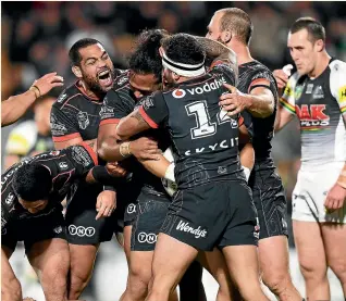  ??  ?? The Warriors always provide their share of highs and lows. Left, they celebrate Mason Lino’s try against Penrith last week; right, Shaun Johnson is downcast during the loss to the Gold Coast Titans in July.