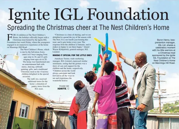  ??  ?? Byron Henry, losspreven­tion manager, IGL Ltd. shares a celebrator­y moment with his little warriors at a Christmas treat sponsored by the Ignite IGL Foundation at The Nest Children’s Home on Mannings Hill Road.