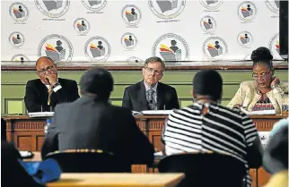  ?? /Alan Eason ?? Advice: From left, Gregory Ally, Judge Jonathan Heher and Leah Khumalo of the Heher commission. The commission found that the country could not afford free tertiary education.