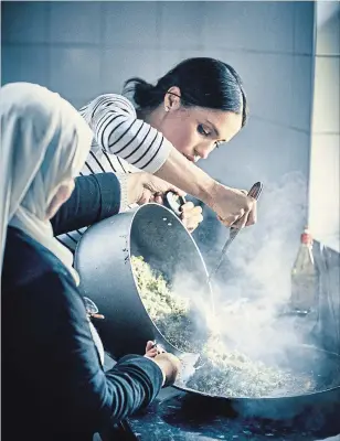  ?? GETTY IMAGES ?? Meghan Markle, Duchess of Sussex, said she liked how the communal kitchen project at the Al Manaar Muslim Cultural Heritage Centre’s Hubb Community Kitchen empowered women.