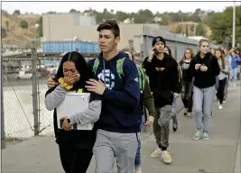  ?? MARCIO JOSE SANCHEZ — THE ASSOCIATED PRESS FILE ?? This file photo shows students being escorted out of Saugus High School after a shooting on the campus in Santa Clarita.
