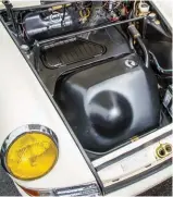  ??  ?? Below left and centre: 917inspire­d gear knob shifts the 901 gearbox’s ratios, its gate pattern mapped out on the horn push of the Momo Prototipo steering wheel. Seat is a genuine S/t-style Recaro 1328 bucket
Below right: The 100-litre fuel tank is an Early911pa­rts reproducti­on, a subtly modernised and stronger version of the original design