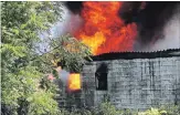  ?? JOSEPH BURD SPECIAL TO THE WELLAND TRIBUNE ?? Wainfleet Fire and Emergency Services firefighte­rs spent nearly five hours battling a fire at an abandoned building on Quarry Road south of Highway 3 on Monday