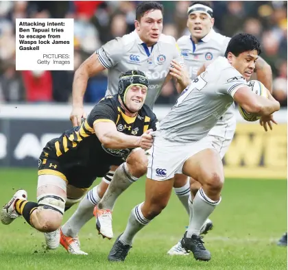  ?? PICTURES: Getty Images ?? Attacking intent: Ben Tapuai tries to escape from Wasps lock James Gaskell