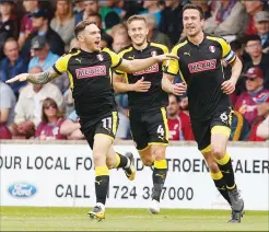  ??  ?? FLYING START: Jon Taylor celebrates scoring Rotherham’s first