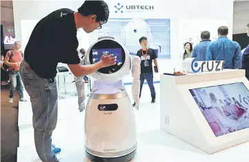  ?? — Reuters photo ?? A Ubtech Cruz humanoid robot is pictured at the IFA Electronic­s Show in Berlin, Germany. The IFA is a showcase for connected home devices that allow people to control appliances and manage energy usage via a smartphone or tablet.