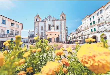  ?? RICK STEVES ?? Évora, the workaday capital of Alentejo, is a fine place to taste the delights of Alentejo — both edible and historic, as well as musical and social.