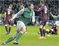  ??  ?? Grant Holt celebrates after making it 2-0 to Hibs.