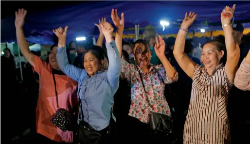  ?? AP ?? People celebrate after the evacuation of all trapped at Tham Luang cave in the Mae Sai, in Chiang Rai. —