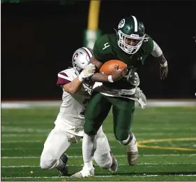  ?? PETE BANNAN - MEDIANEWS GROUP ?? Ridley’s Tahir Mills proves how tough he is to bring down in the third quarter Friday night during the Green Raiders’ win over Conestoga.