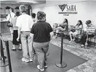  ?? William Luther / Staff file photo ?? People wait in line in 2007 for affordable housing at San Antonio Housing Authority headquarte­rs. Affordable housing remains difficult for 95,000 in Bexar County.
