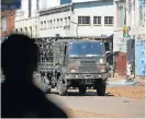  ?? /Reuters ?? Military patrol: Members of the military patrol the streets of Harare, Zimbabwe, on Thursday.