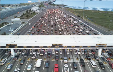  ?? Noah Berger / Special to The Chronicle 2017 ?? Traffic flows through the Bay Bridge toll plaza in 2017. A U.S. Supreme Court immigratio­n ruling may bode well for the environmen­t.